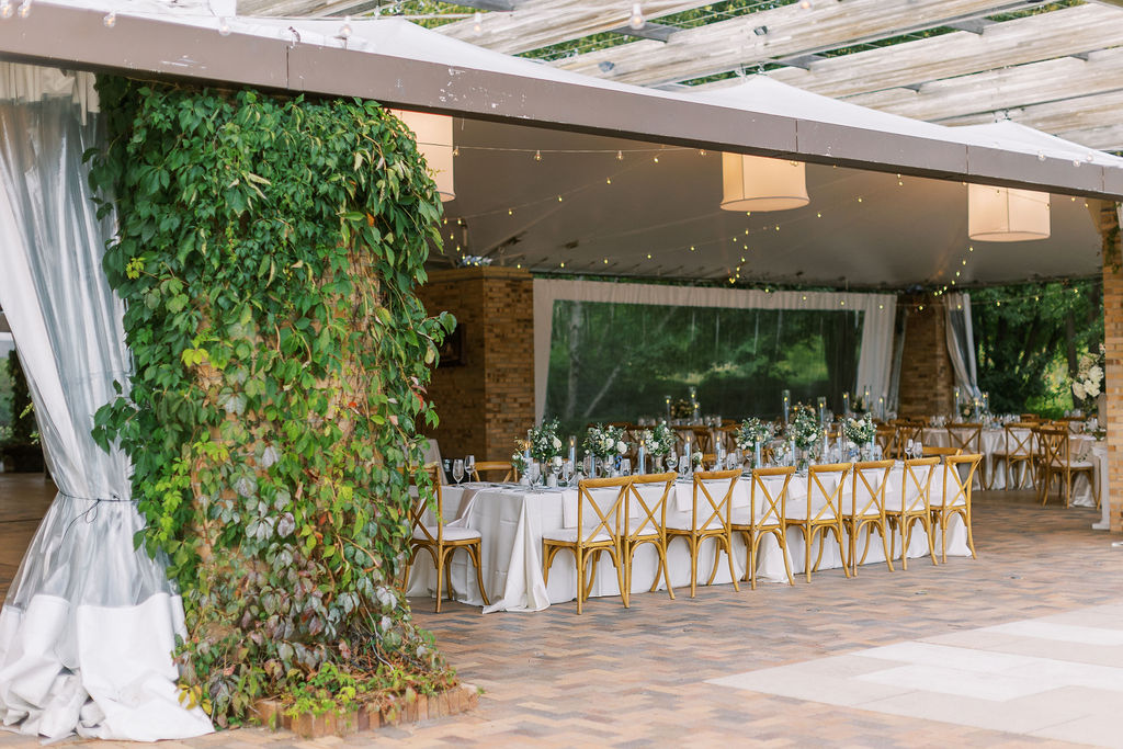 Elegant tent reception setup with string lights at one of the best wedding venues in Chicago