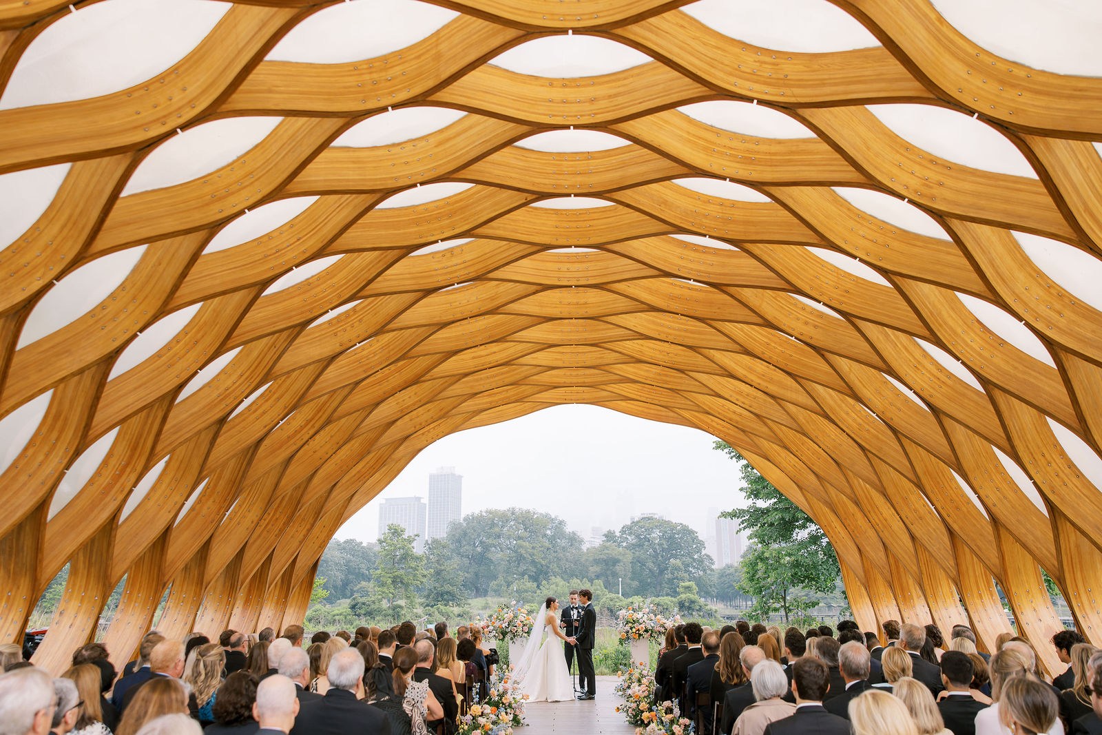 Outdoor ceremony under a wooden pavilion at one of the best wedding venues in Chicago