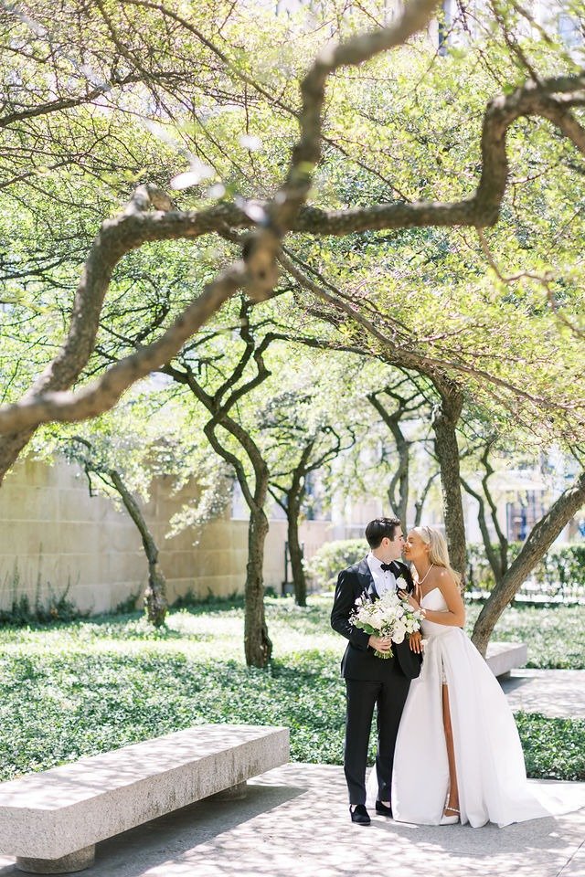 Bridesmaids holding bouquets and smiling outdoors during a wedding ceremony in Chicago