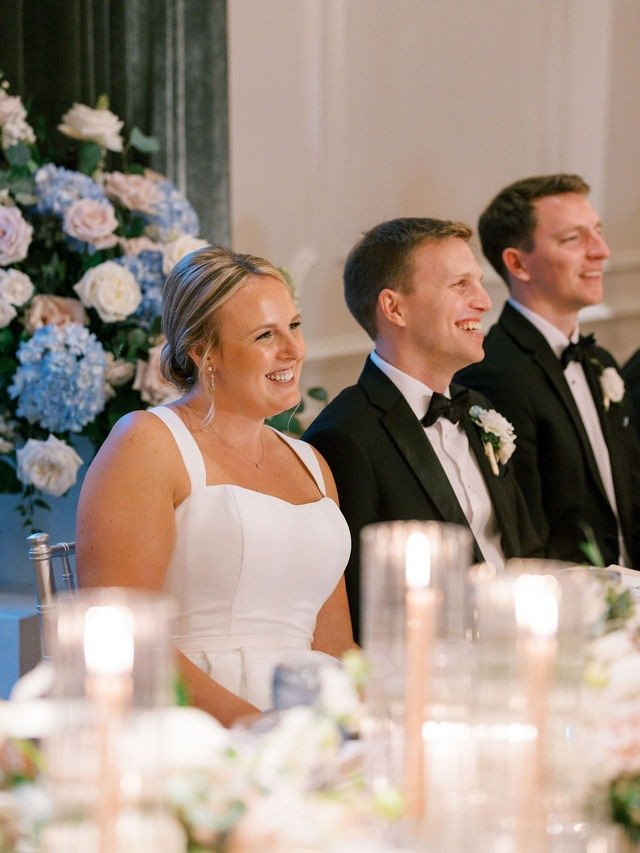 Bride and groom toasting with guests during their reception at their wedding in Chicago