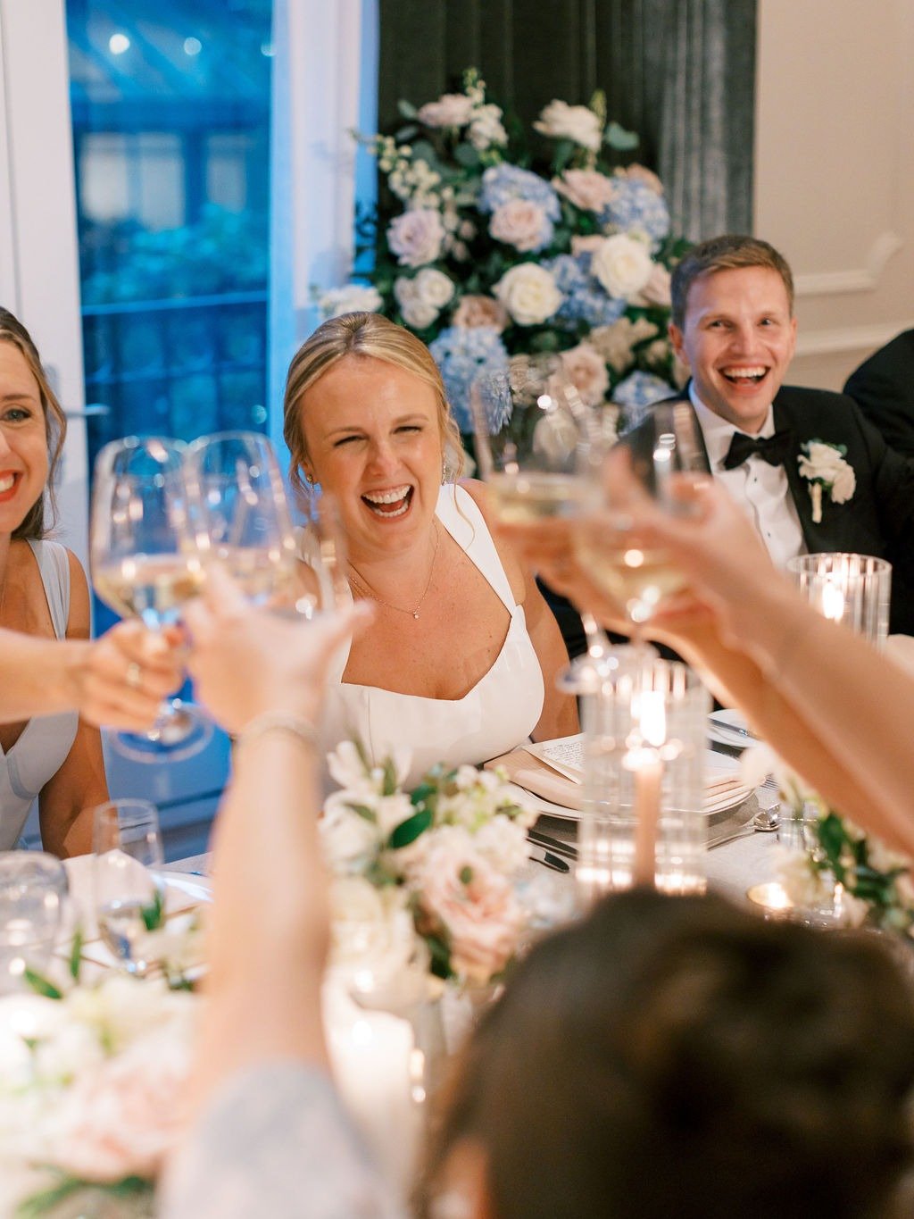 Bride and groom toasting with guests during their reception at their wedding in Chicago