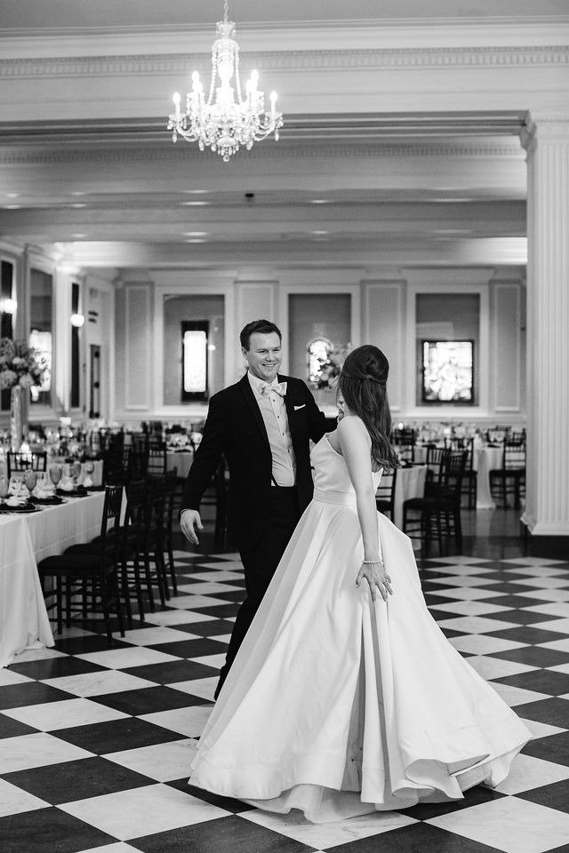 Couple sharing first dance in a grand ballroom during a wedding in Chicago