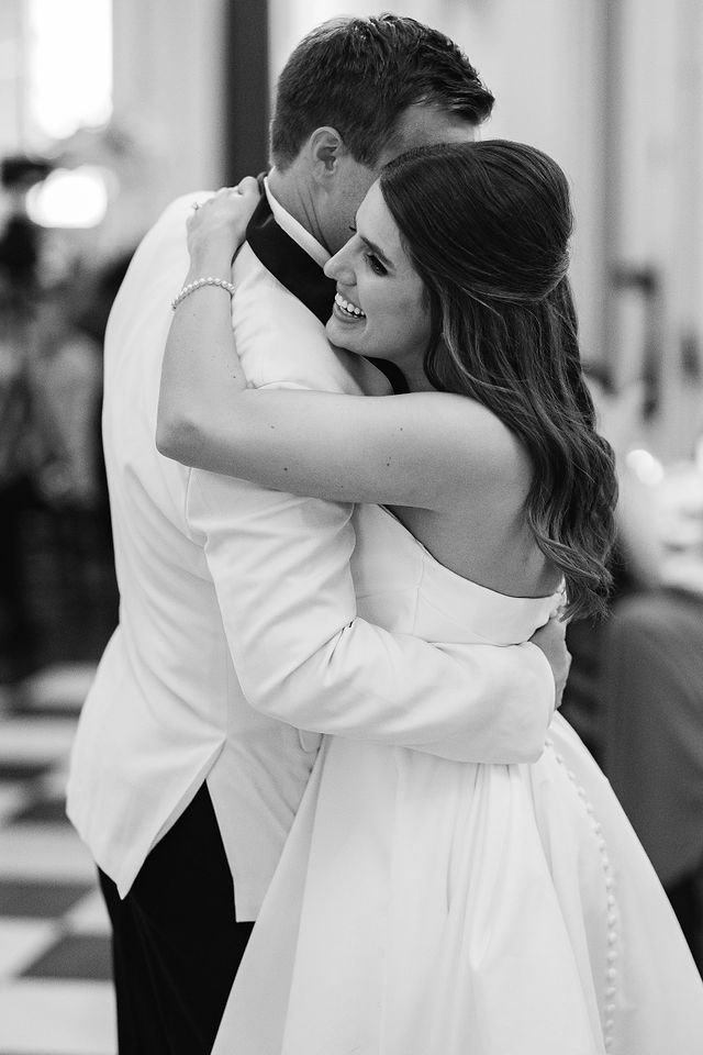 Closeup of couple sharing first dance in a grand ballroom during their wedding reception in Chicago