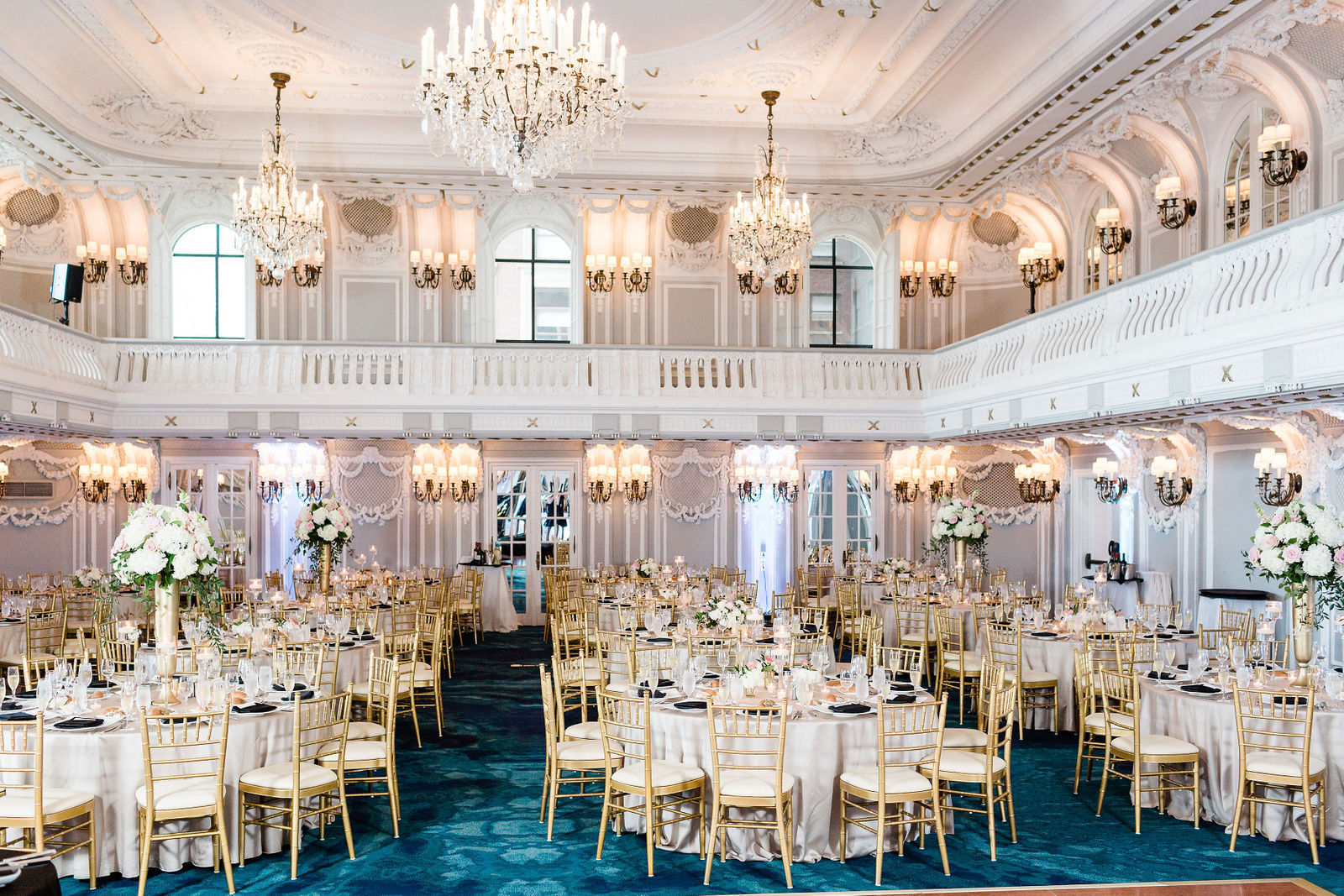 Indoor wedding reception beneath a chandelier as a result of planning a wedding in Chicago Illinois