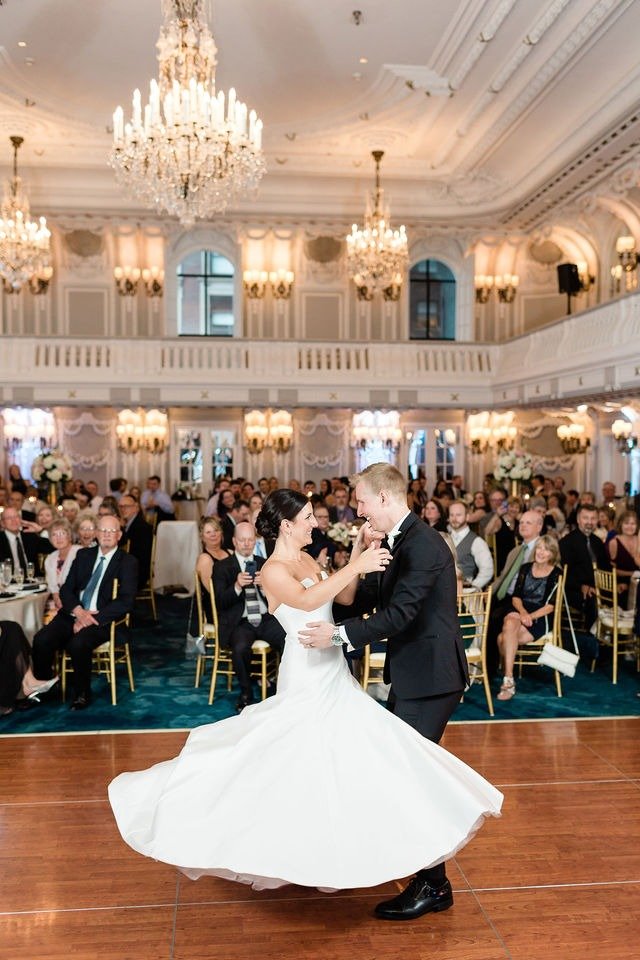 Couple sharing first dance in a grand ballroom while planning a wedding in Chicago