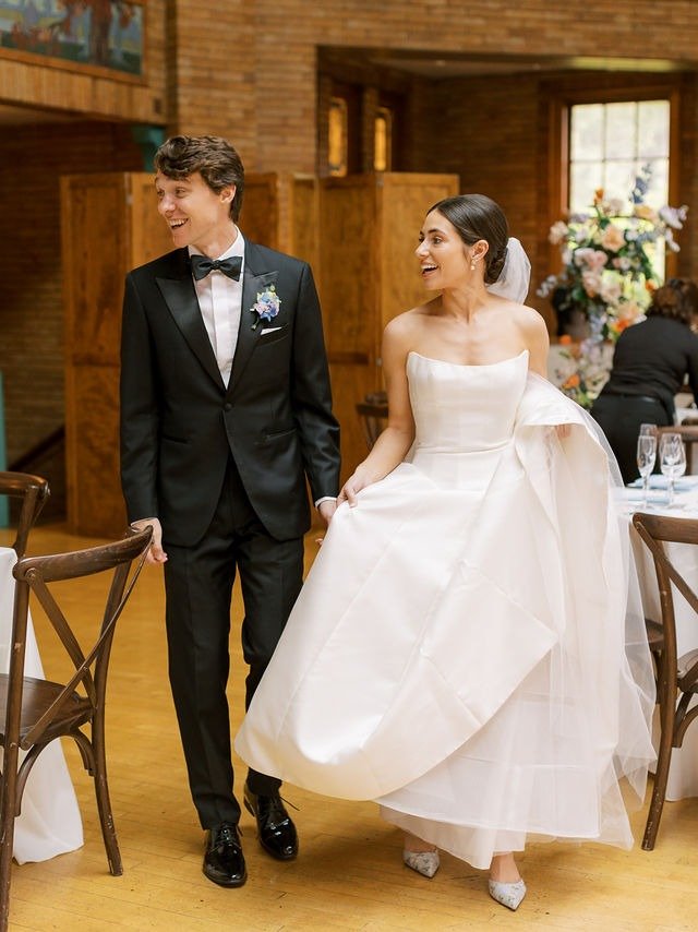 Bride and groom entering their reception space at one of the most beautiful wedding venues in Chicago