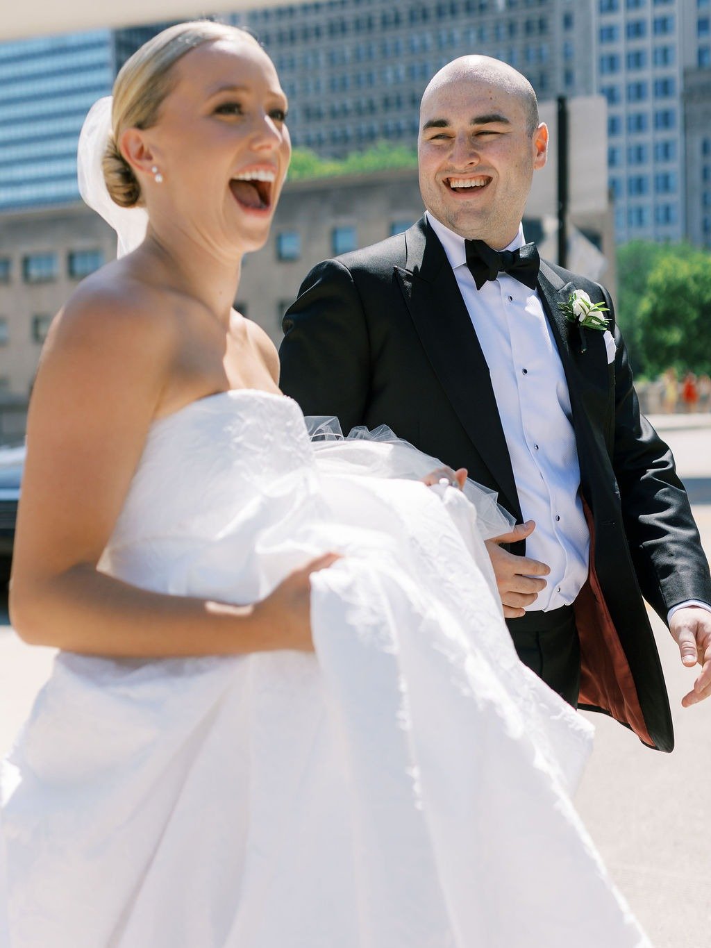Bride and groom smiling outdoors in the city at one of the best wedding venues in Chicago