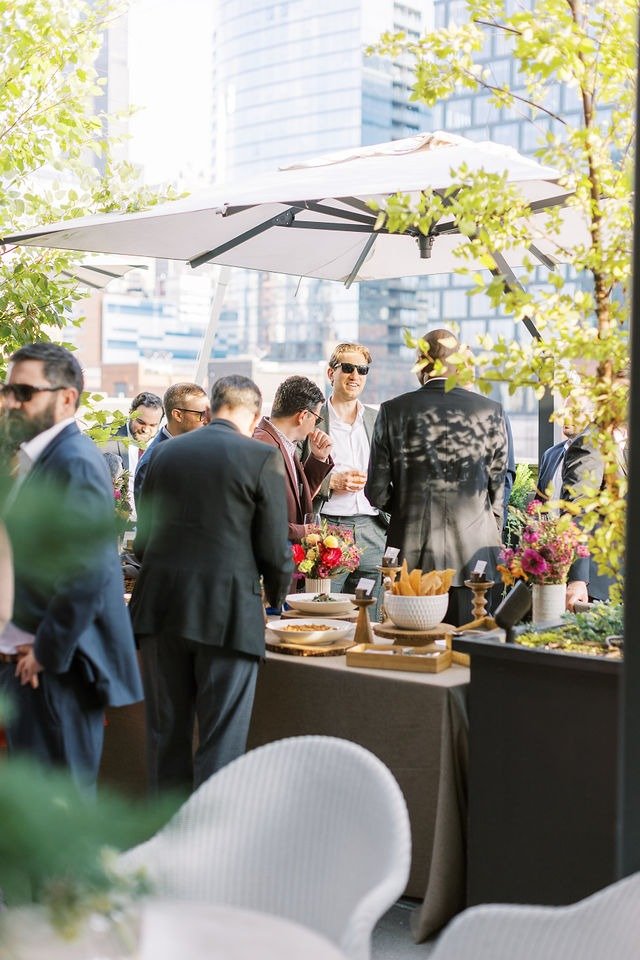 Guests mingling during a rooftop cocktail hour at a wedding reception venue in Chicago