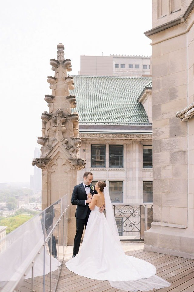 Bride and groom sharing a moment on a rooftop terrace at a wedding venue in Chicago suburbs