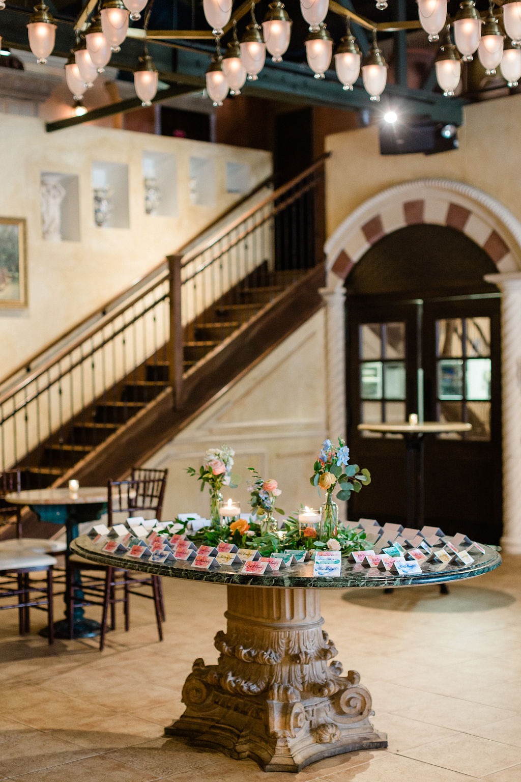 round table with seating arrangement cards for at an outdoor wedding venue in chicago